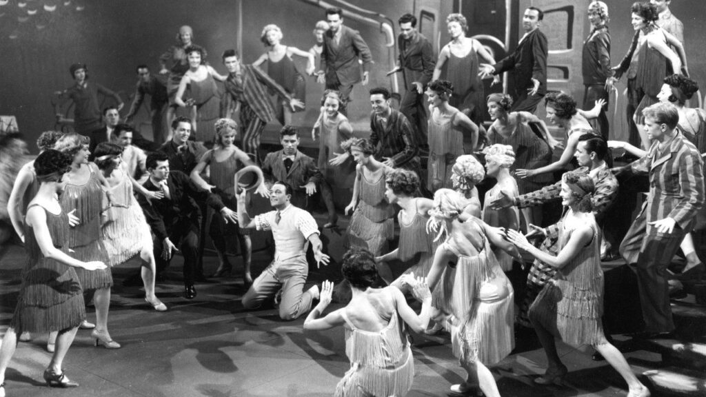 Кадр из фильма «Поющие под дождём (1952)»
